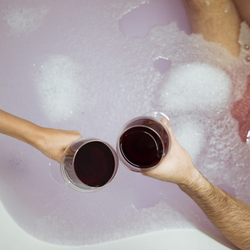 woman man hands with glasses drink near water with foam